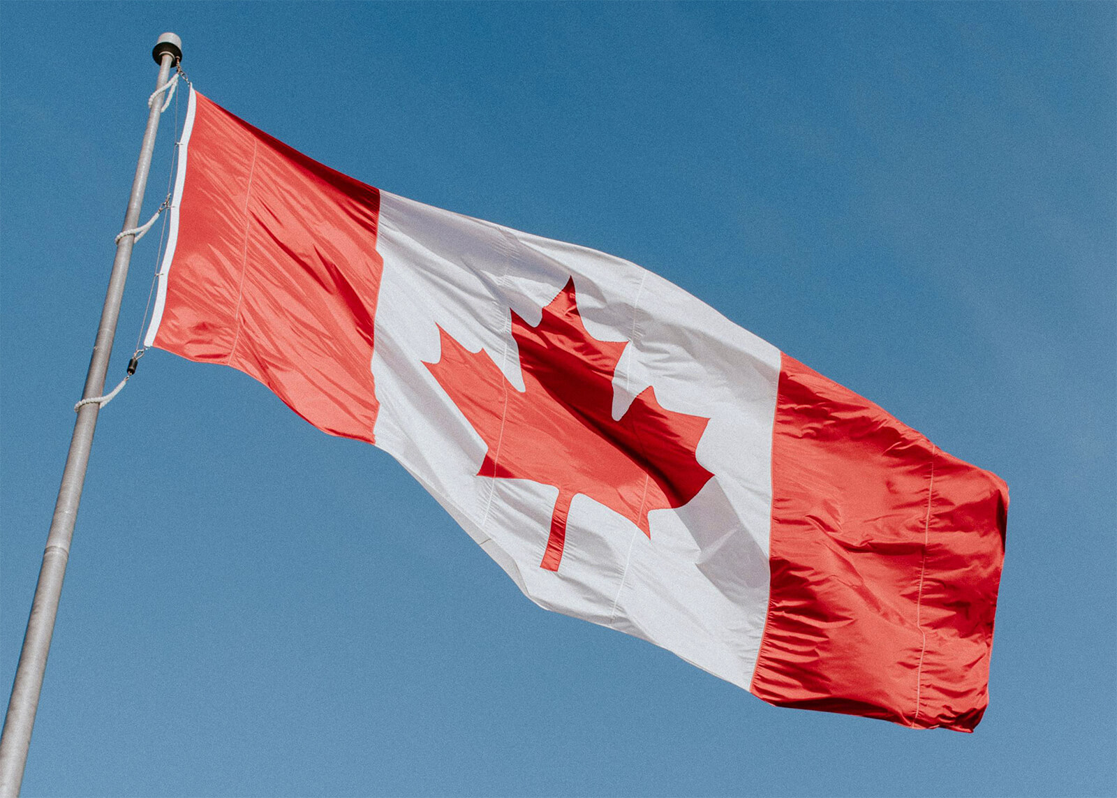 Canadian flag waving in the wind