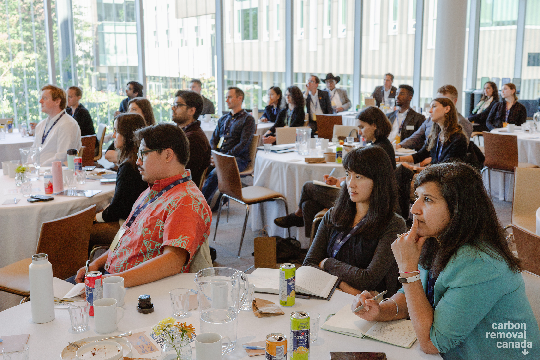 Attendees watch a presentation