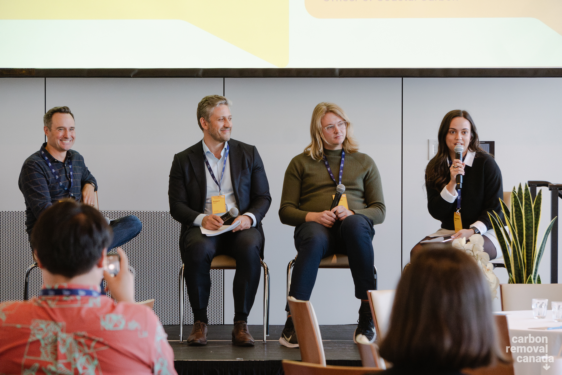 Chantelle Carden moderates a panel with Mike Kelland, Rob Napoli, and Thomas Storwick.