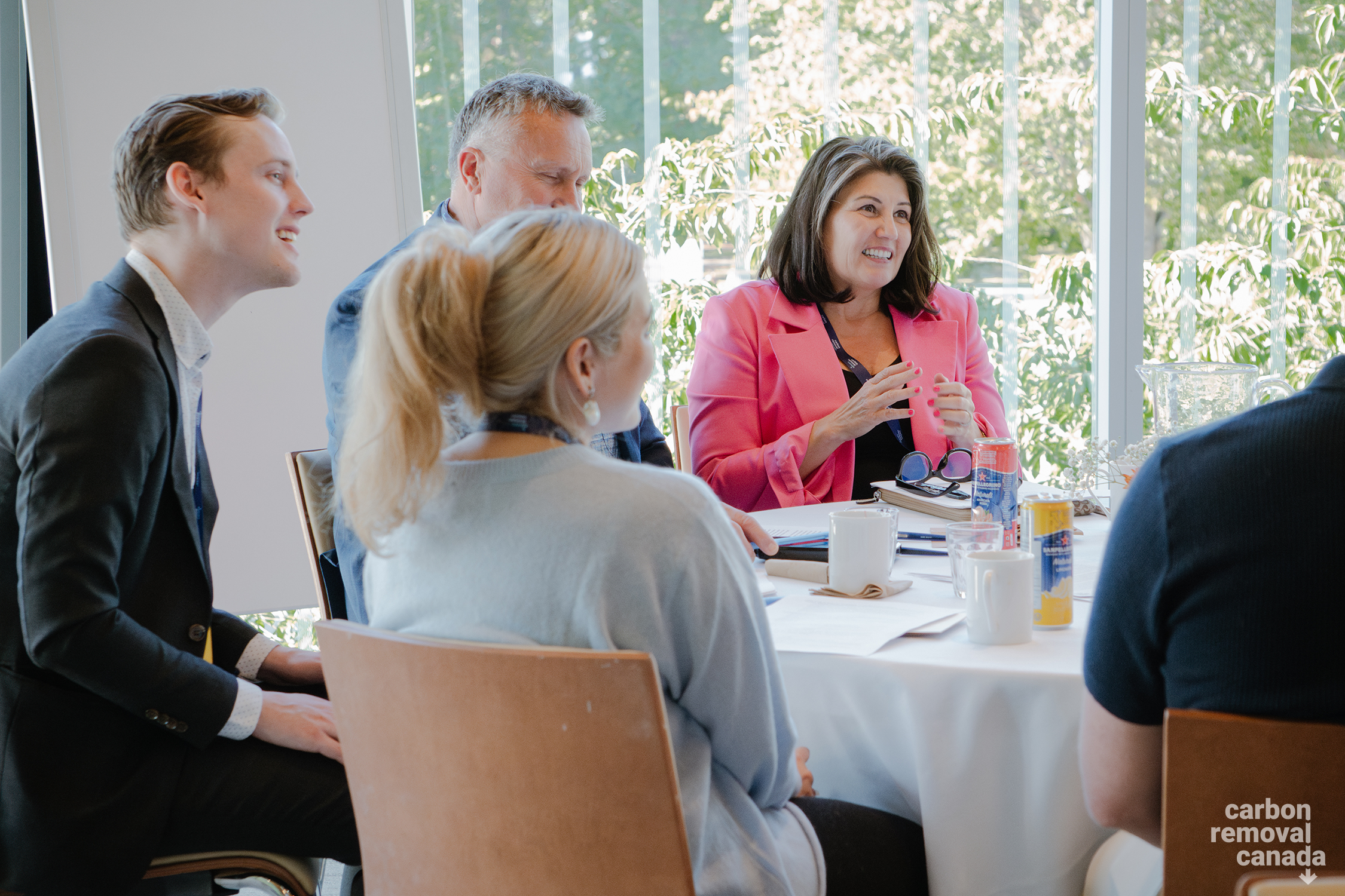 AJ Bird speaks to a group at her table. 